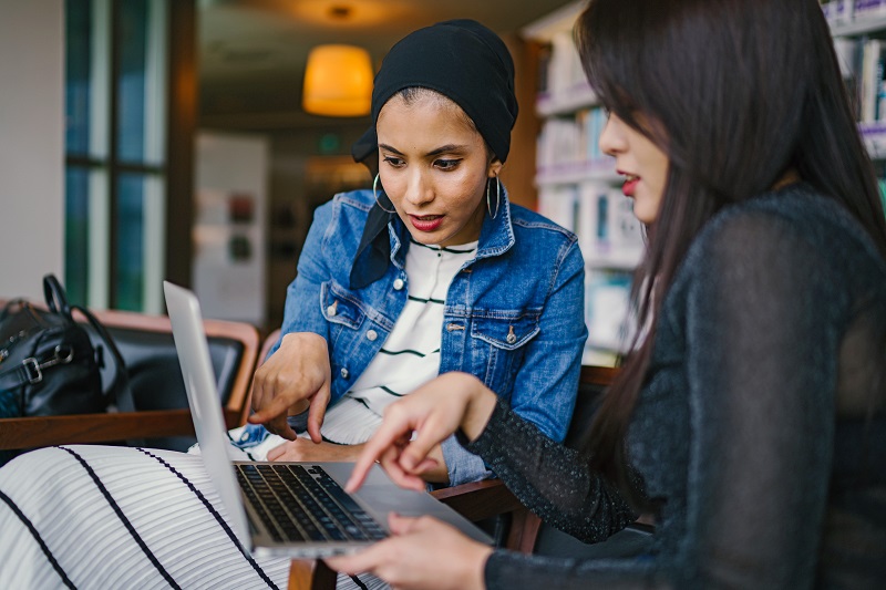 Two girls buying from e-commerce using the Ship From Store model